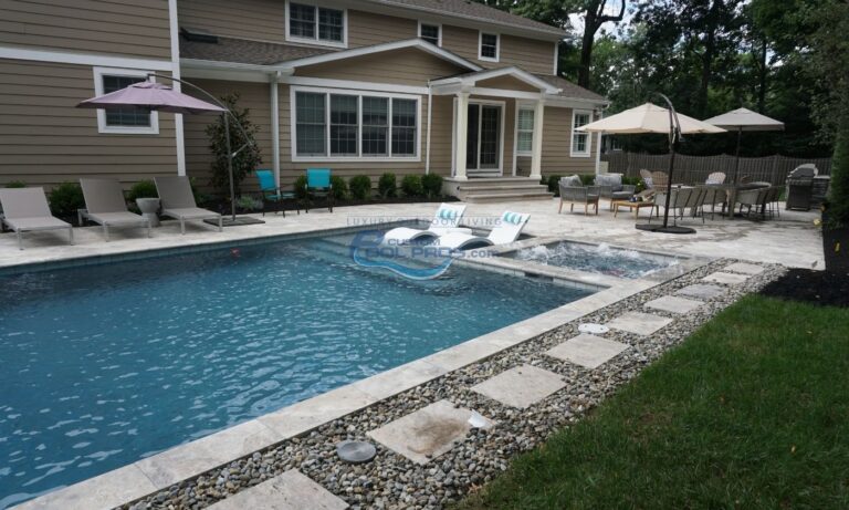 inground pool with spa and sun tanning ledge with chaise lounge chairs, luxury swimming pool, pool builders