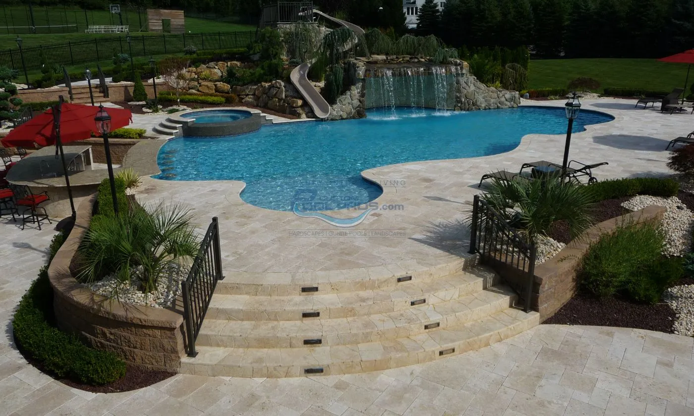 custom freeform gunite pool with spa, water fall, pool deck, swim up bar, slide, inground pool
